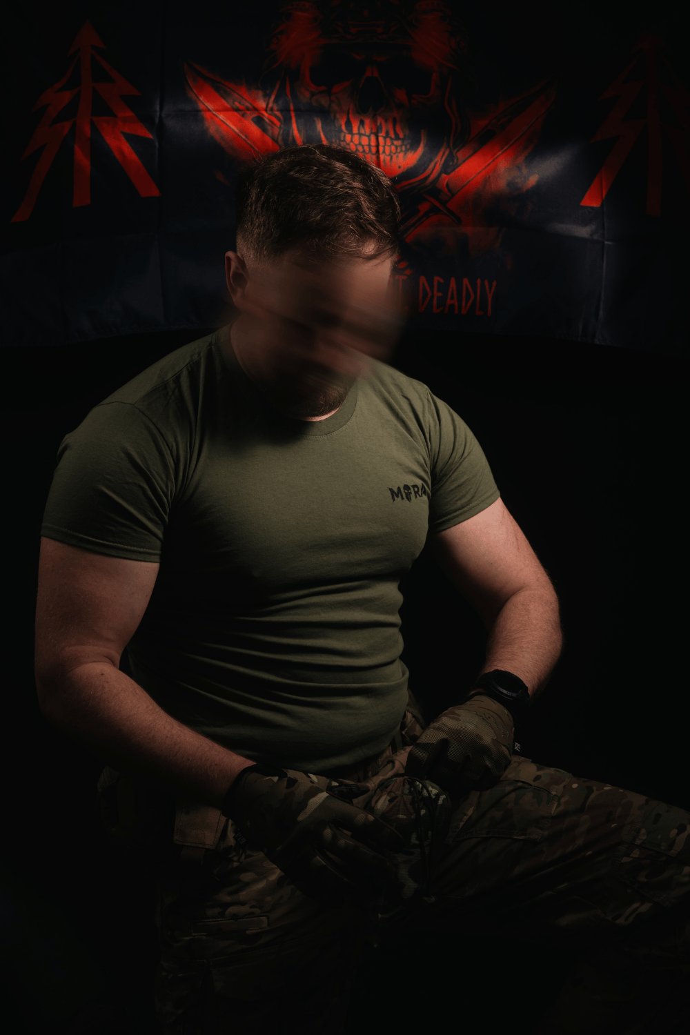 Mora Tactical Stowaway waterproof jacket getting packed away in small bag by British Recce Soldier.