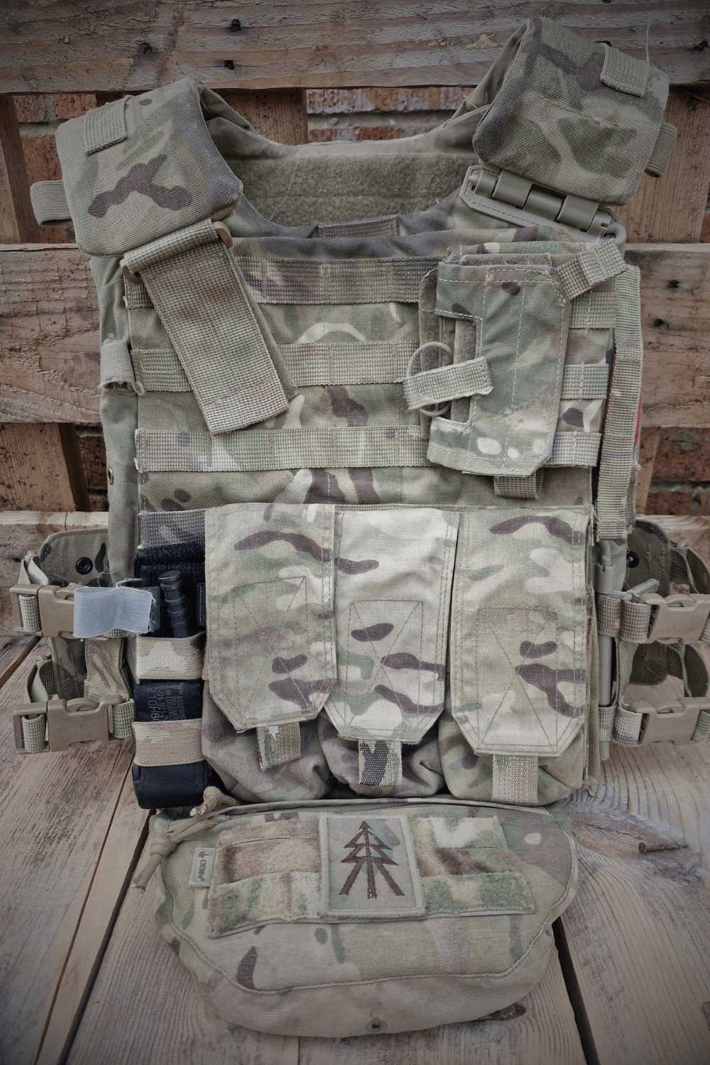 Virtus body armour with TQ attached to it and 5.56 magazine pouches and a recce tree patch on a Odin dangler pouch.