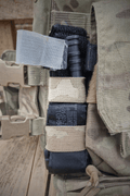 TQ holder with a TQ in it attached to British Army Virtus body armour.