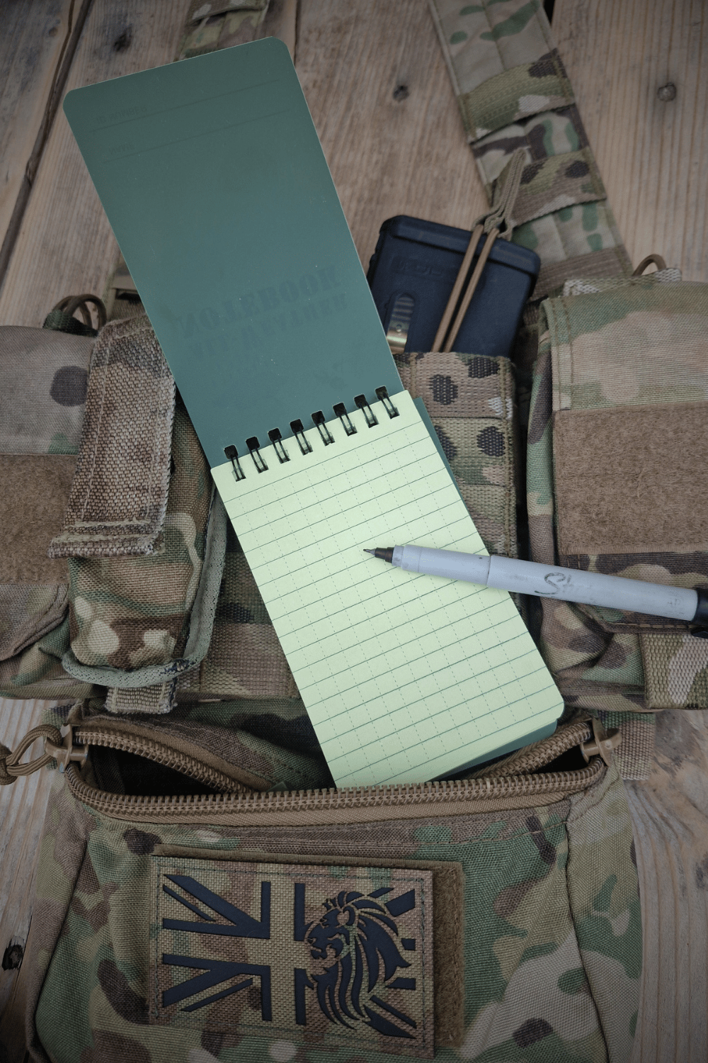 Green waterproof notepad.
